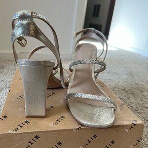 New Silver/Gold 11M heel. Worn once. Great condition. Adjustable.